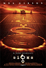 a one poster for the film Signs, with an aerial view of of crop circles in a a cornfield at sunset